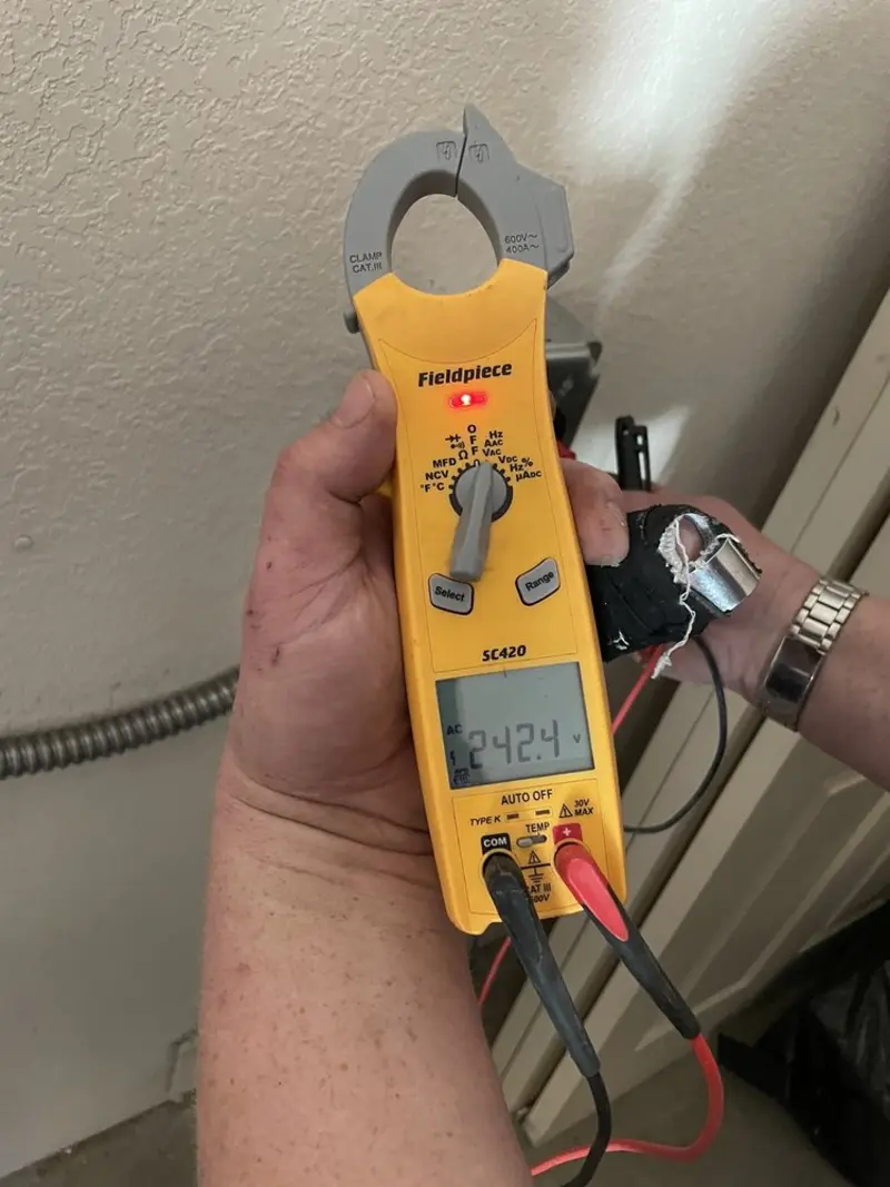 Voltage testing with clamp meter during Circuit Breaker Repair in Xenia